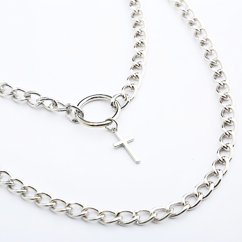 Alternative layered necklace with a metal cross and lock, perfect for punk and grunge styles.