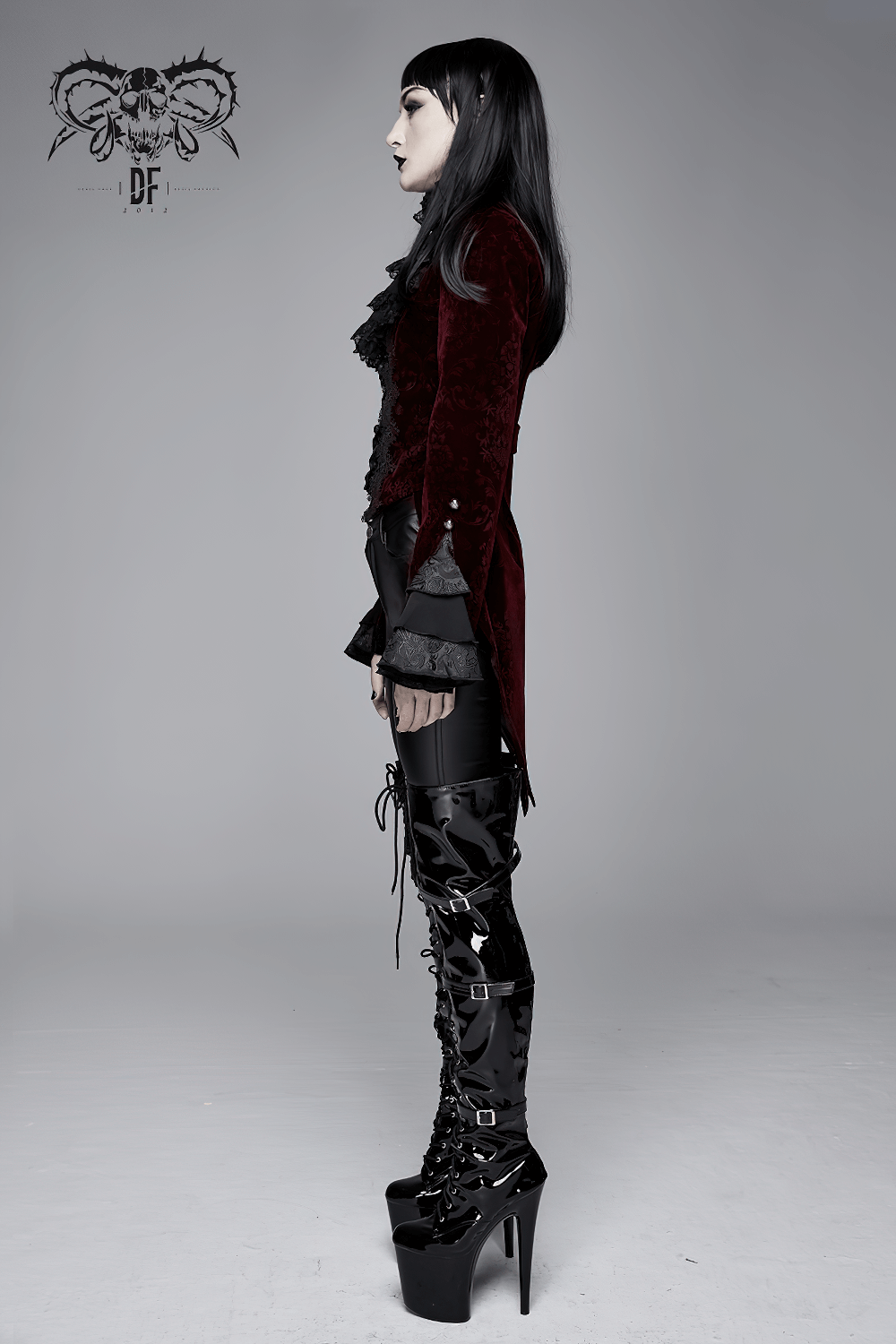 Alternative women's wine red puff sleeved jacket in gothic style, showcasing luxurious velvet and vintage silhouette.