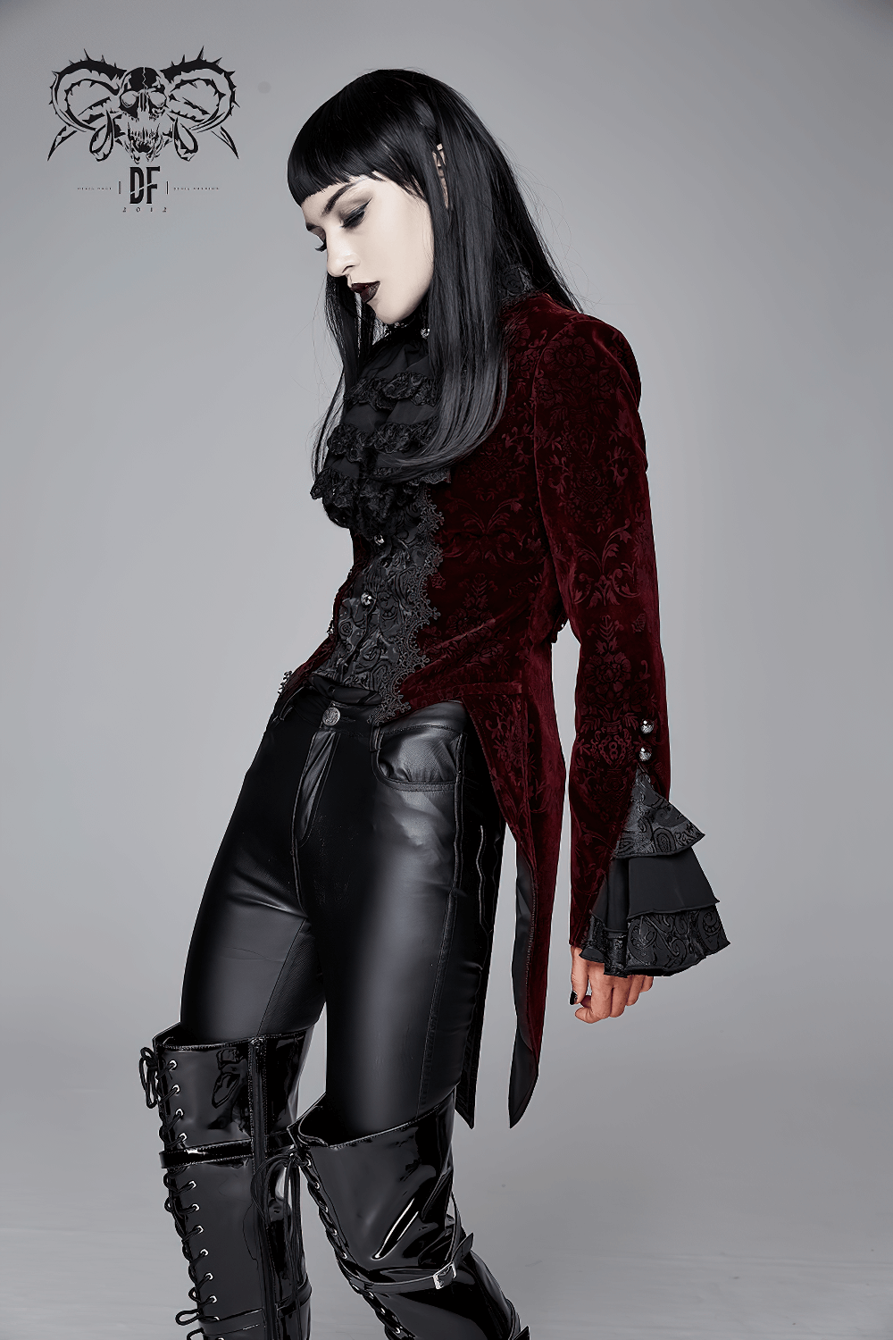 Gothic women's wine red velvet jacket with puff sleeves, styled for a vintage elegant look.
