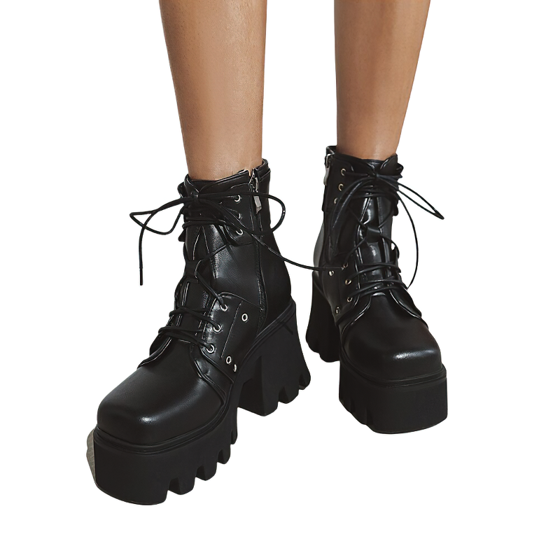 Trendy black women’s ankle boots with chunky heels, platform soles, and stylish lace-up design.