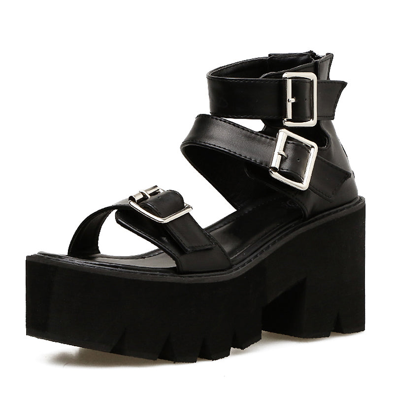 Black ankle strap alternative fashion sandals with thick platform and buckles, perfect for a Gothic style look.