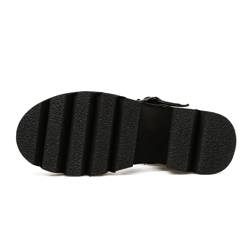 Close-up of the sole of women's ankle strap sandals featuring a thick, textured rubber bottom for comfort and grip.