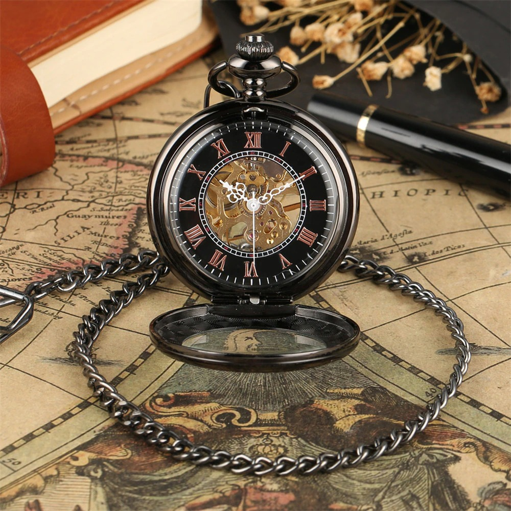 Antique black mechanical pocket watch with Roman numerals and silver fittings on vintage map background.