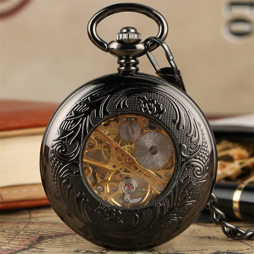 Antique black mechanical pocket watch with intricate engraving and a exposed golden mechanism, perfect as a gift.