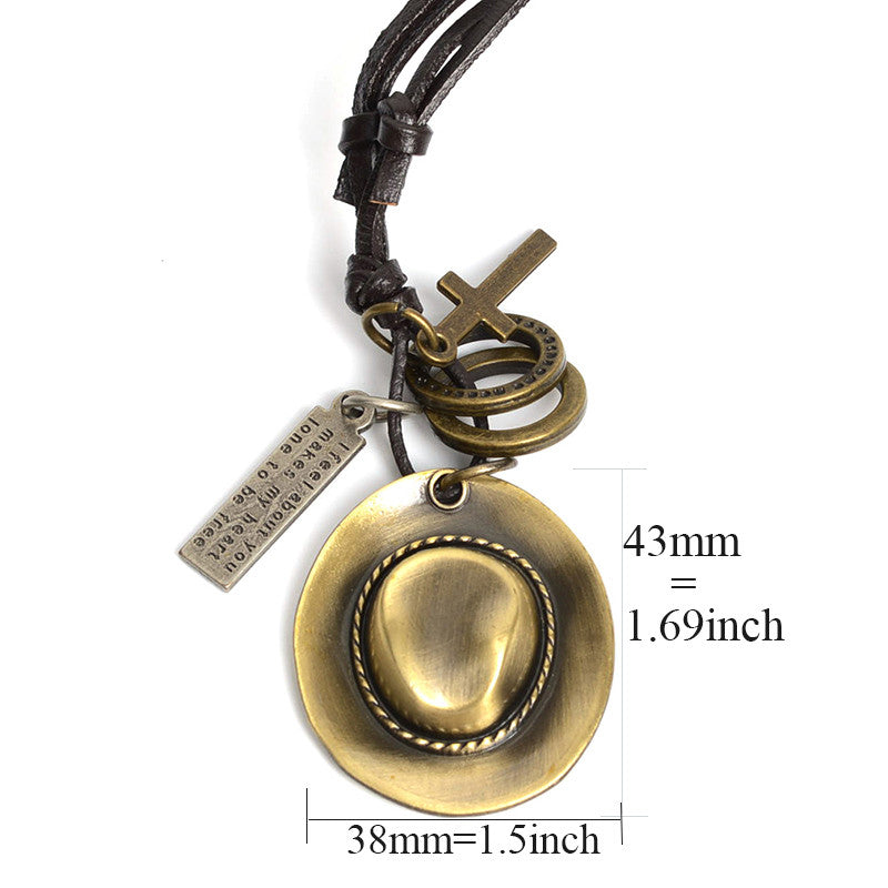 Antique cowboy hat pendant necklace with rings and crosses on a rope chain, perfect Western style accessory.