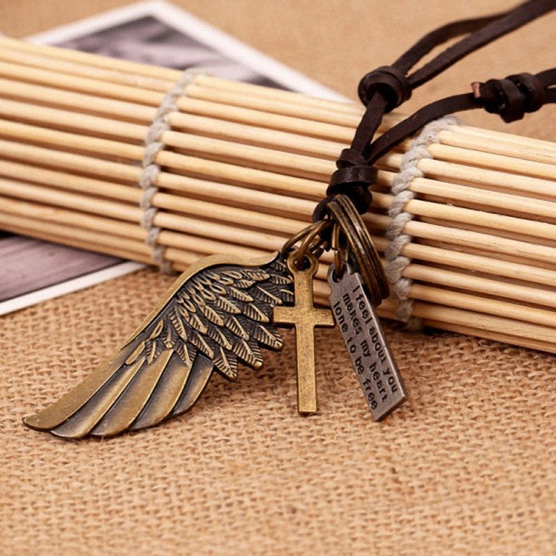 Antique angel wing leather necklace with cross and text charms, perfect accessory for trendy outfits.