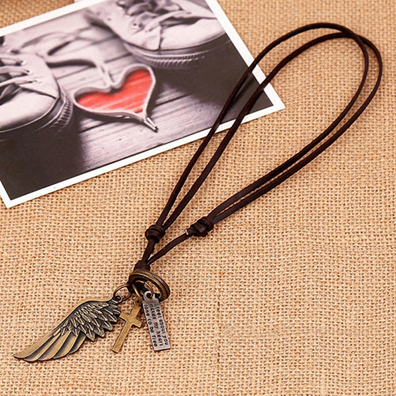 Antique vintage leather necklace featuring angel wing and cross pendants, perfect for stylish concert outfits.