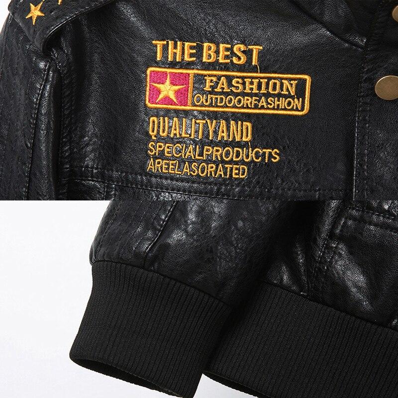 Close-up of army leather jacket showing military insignia and quality embroidery details.