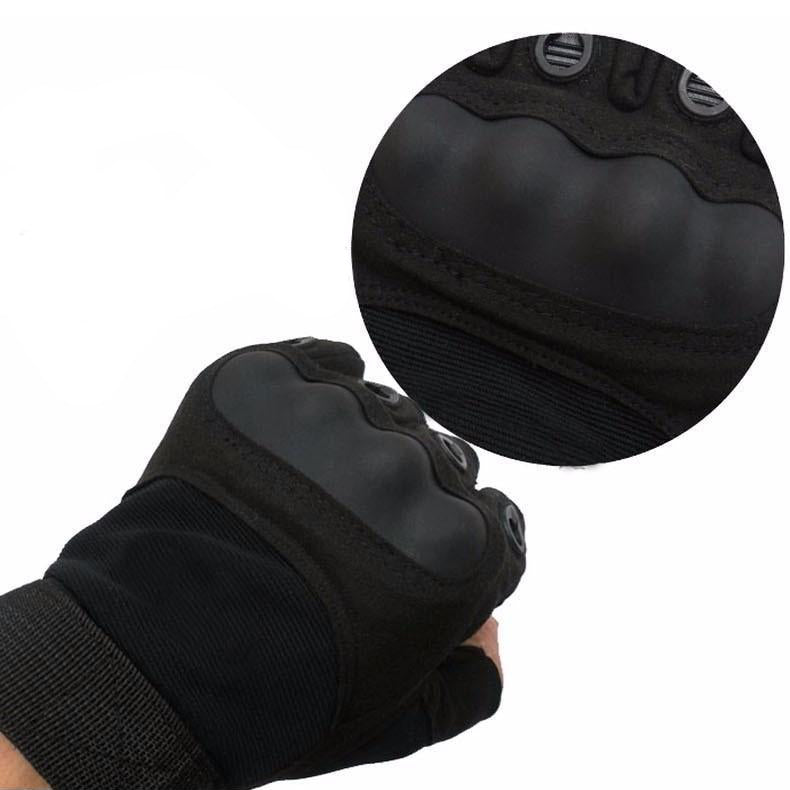 Close-up of black army tactical gloves showcasing anti-slip carbon fiber knuckles and secure fit for military activities.