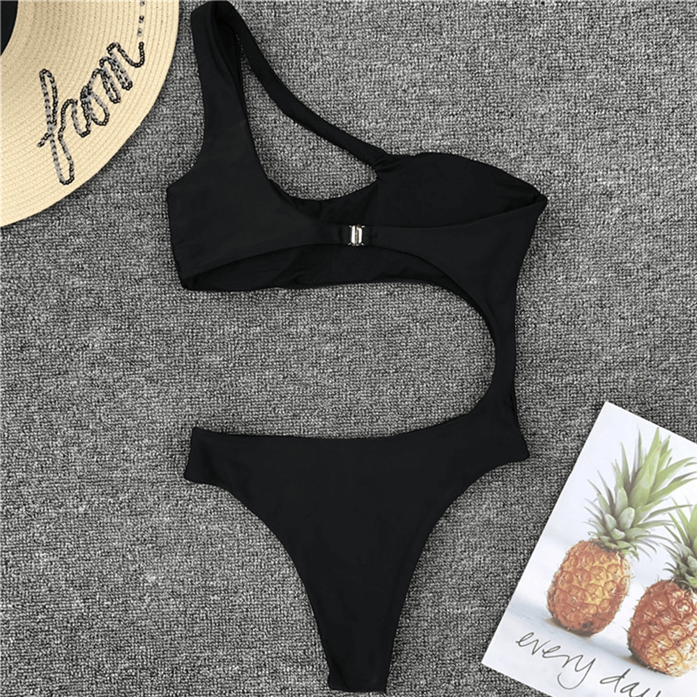 Stylish women's black asymmetric one-piece swimsuit with a unique cut, perfect for summer beach outings.