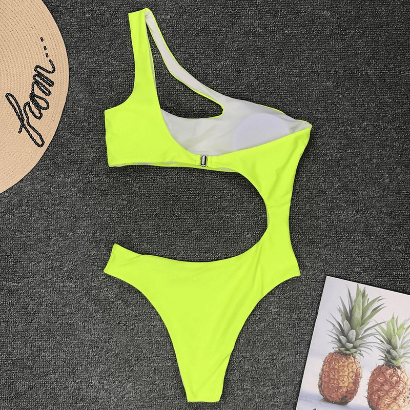 Bright neon yellow asymmetrical one-piece swimsuit for women, stylish and trendy casual swimwear.