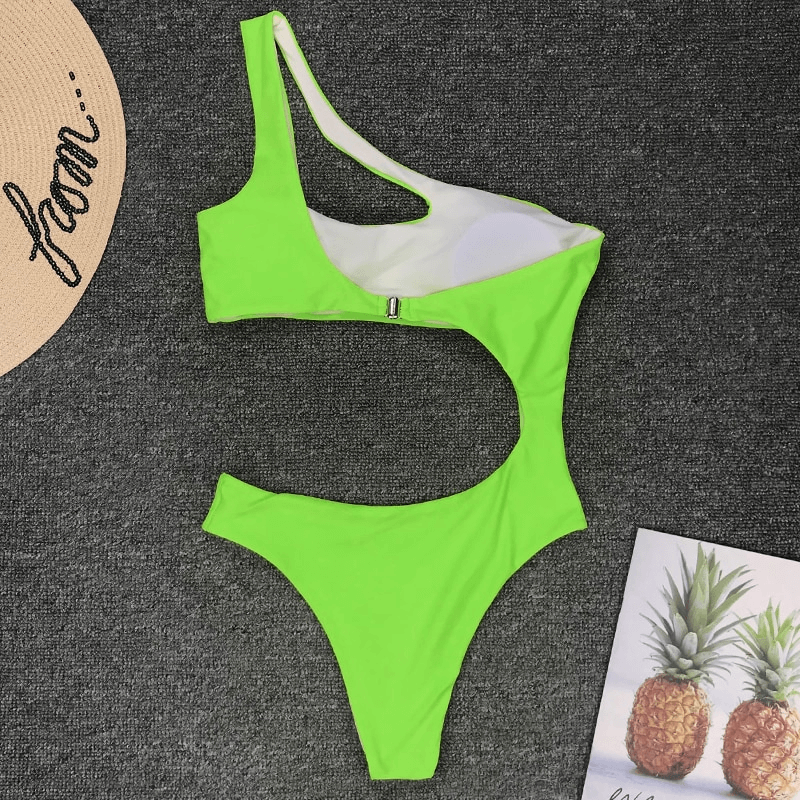 Bright green asymmetrical one piece swimsuit for women, perfect for beach outings and summer fun.