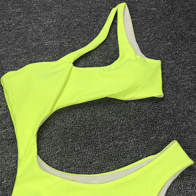 Vibrant yellow asymmetrical bikini top showcasing casual, stylish one-piece design for women.