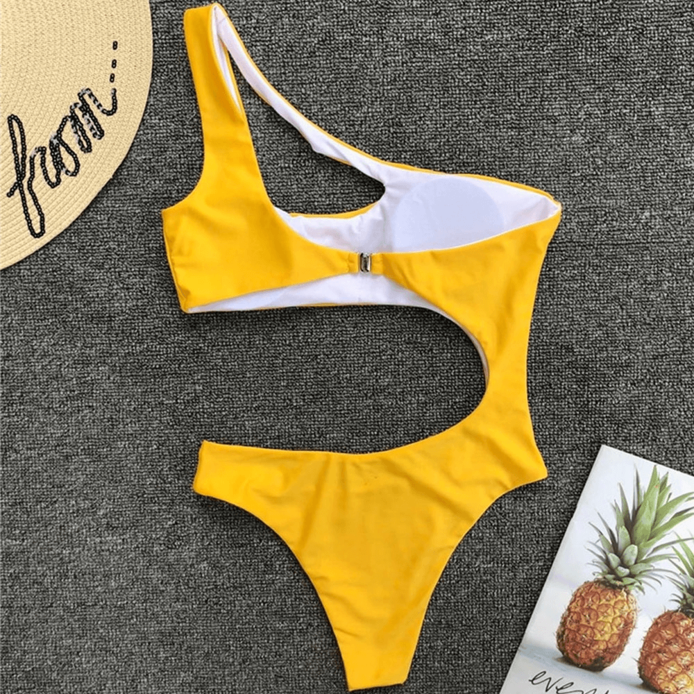 Stylish yellow asymmetrical one-piece swimsuit for women, featuring a trendy cut and casual design.