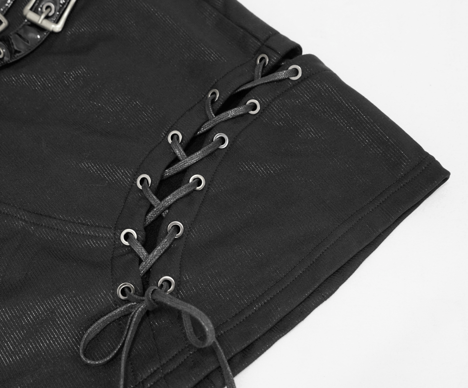 Close-up of gothic style black mini skirt showing lacing detail on one side and decorative buckles.