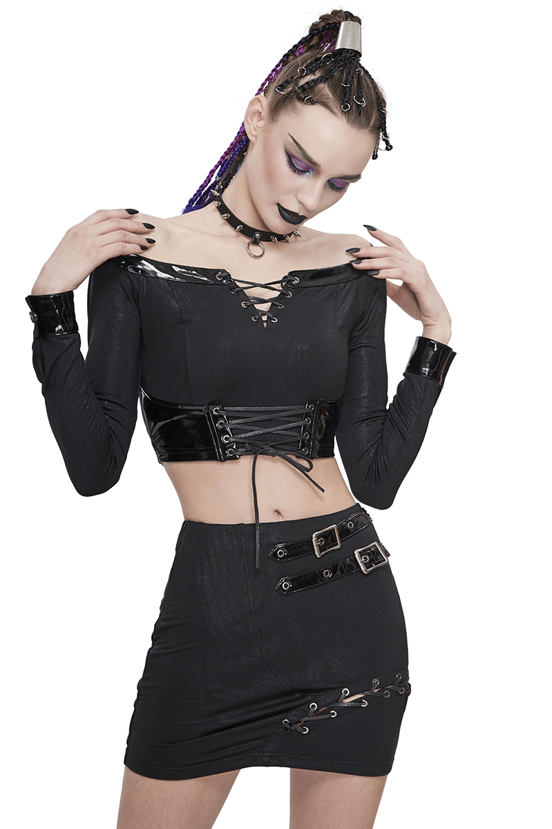 Gothic style women's outfit featuring an asymmetric mini skirt with buckles and a matching cropped top.