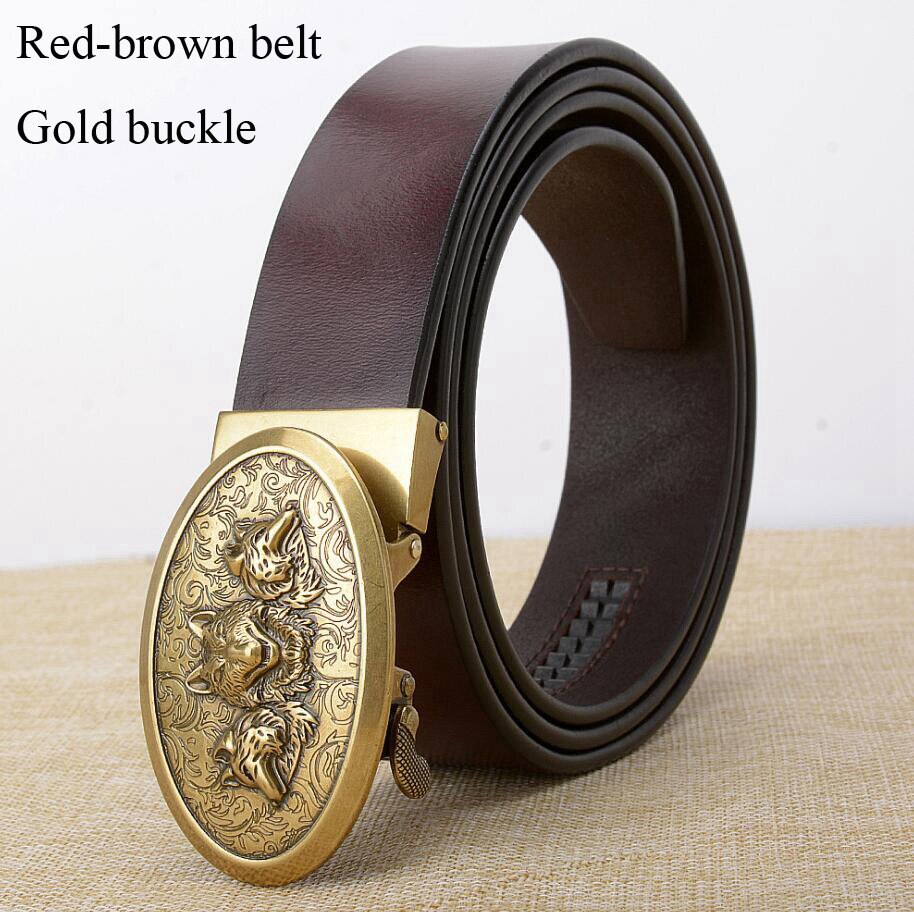 Red-brown cowhide leather belt with ornate gold buckle featuring wolf design, perfect for stylish fashion statements.