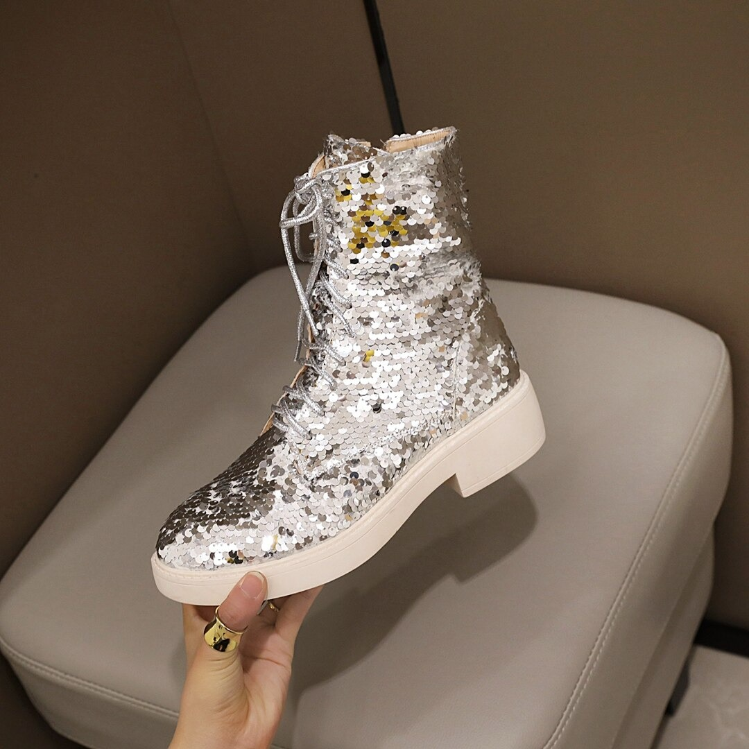 Stylish women's PU leather ankle boots covered in sequins, featuring laces and a trendy design for autumn and winter fashion.