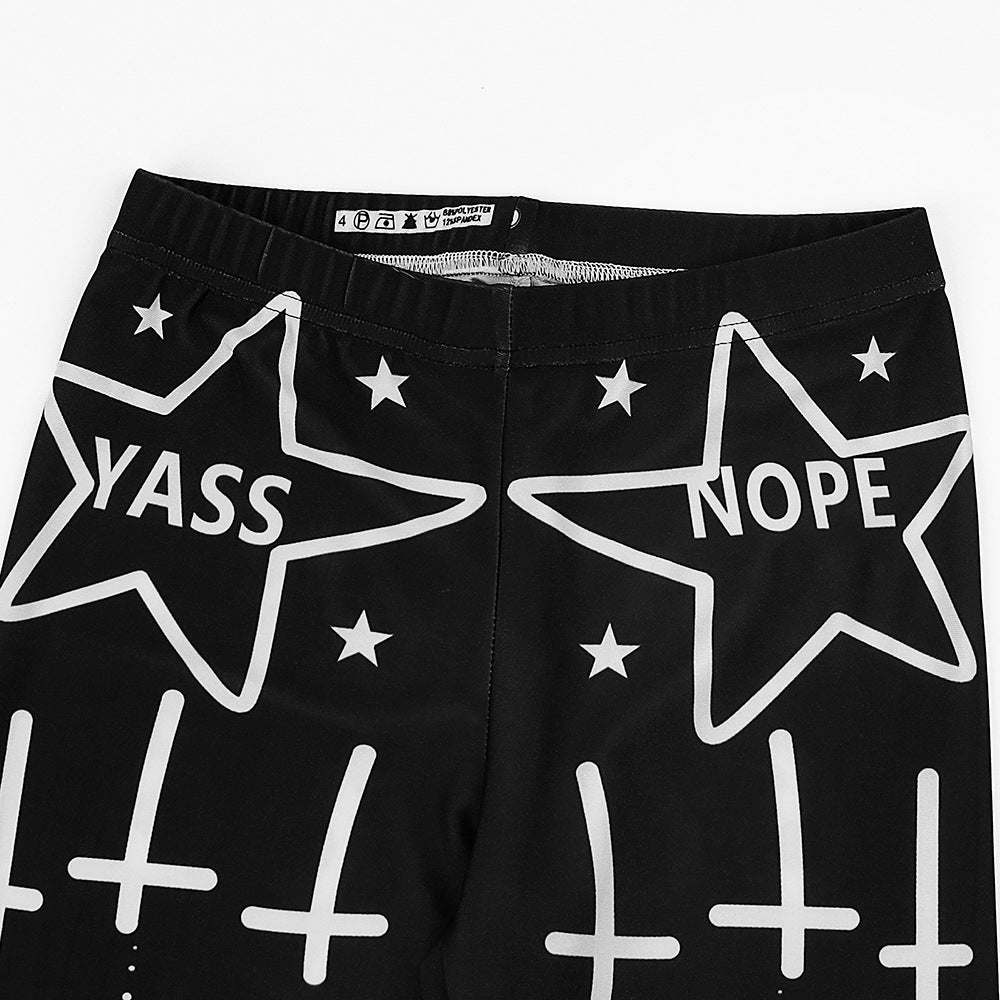Close-up of Bad Girl leggings featuring 'YASS' and 'NOPE' phrases with star designs, perfect for alternative fashion.