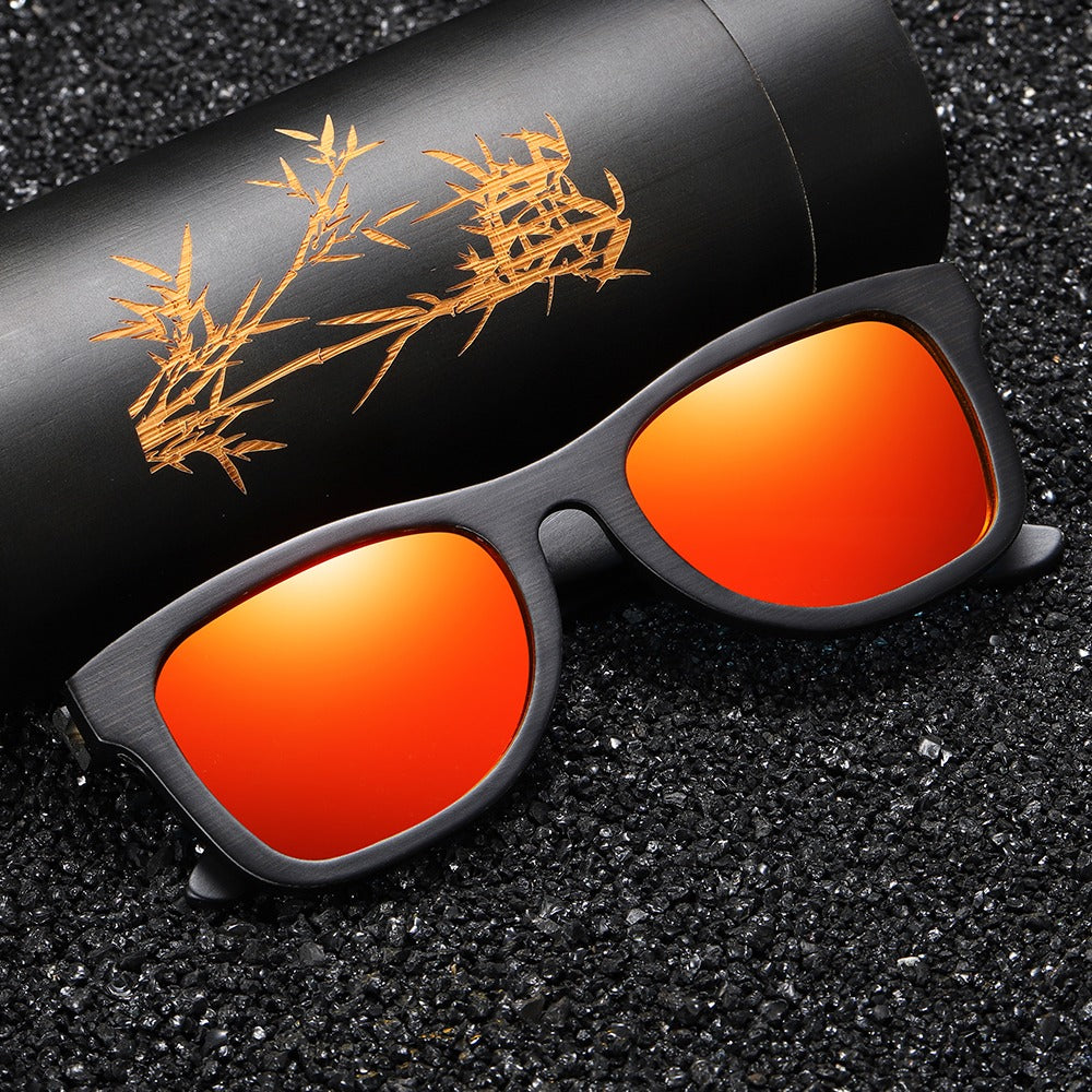 Bamboo unisex polarized sunglasses with red lenses, stylish wooden frame, and elegant packaging.