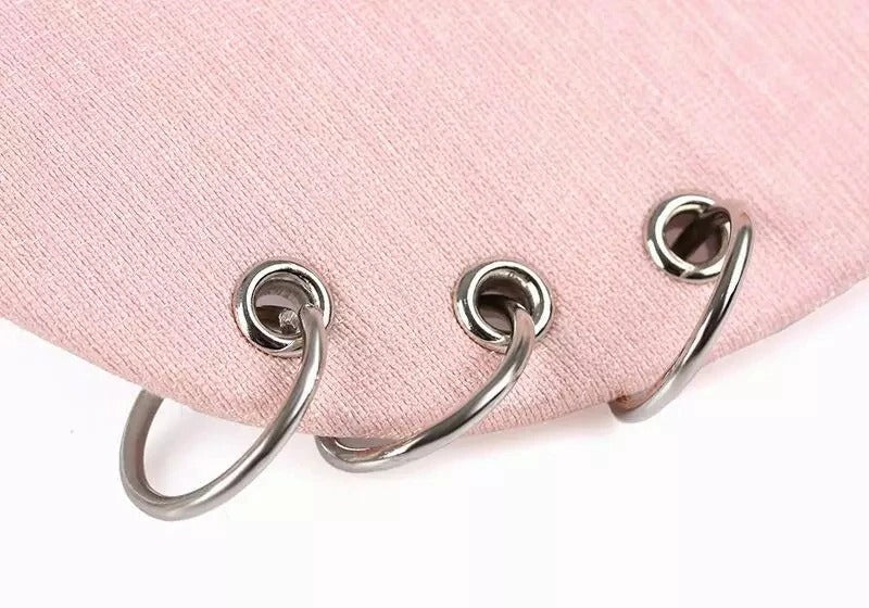 Close-up of a unisex baseball cap featuring unique metal rings, perfect for rave outfits and alternative style.