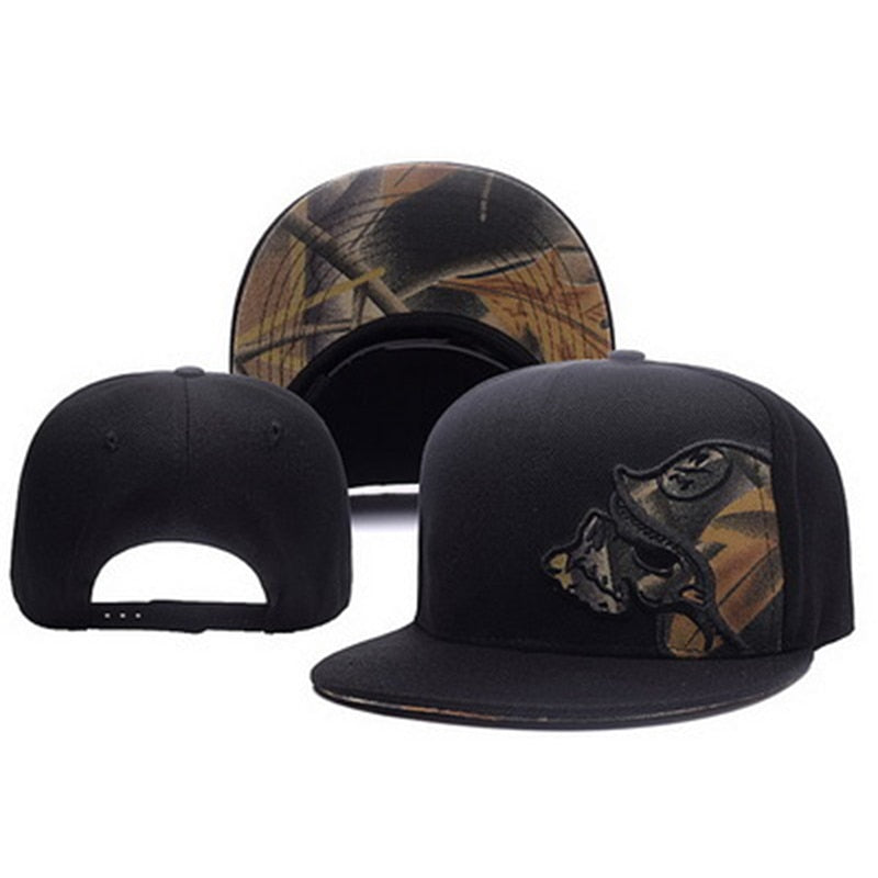 Black baseball cap with skull embroidery and camo visor, flat brim design, adjustable fit, outdoor fashion accessory.