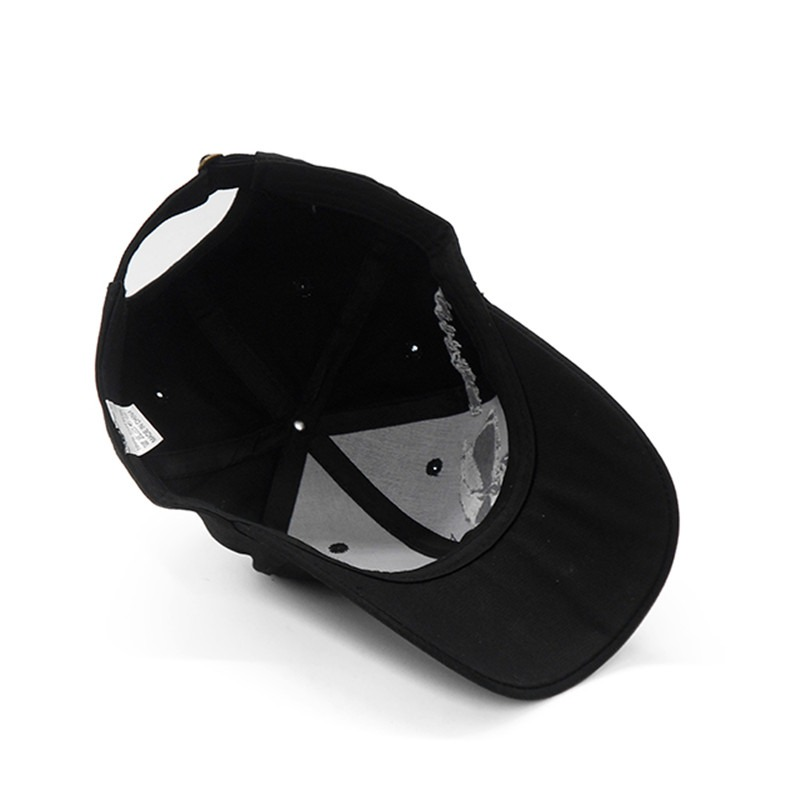 Inside view of a black baseball cap with a skull design, perfect for rave outfits and rock fashion.