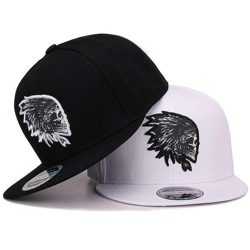 Stylish black and white snapback caps featuring embroidered skull designs perfect for a unique rock style look.