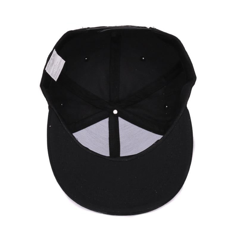 Inside view of a black snapback baseball cap with a flat brim, showing the structured crown and adjustable straps.