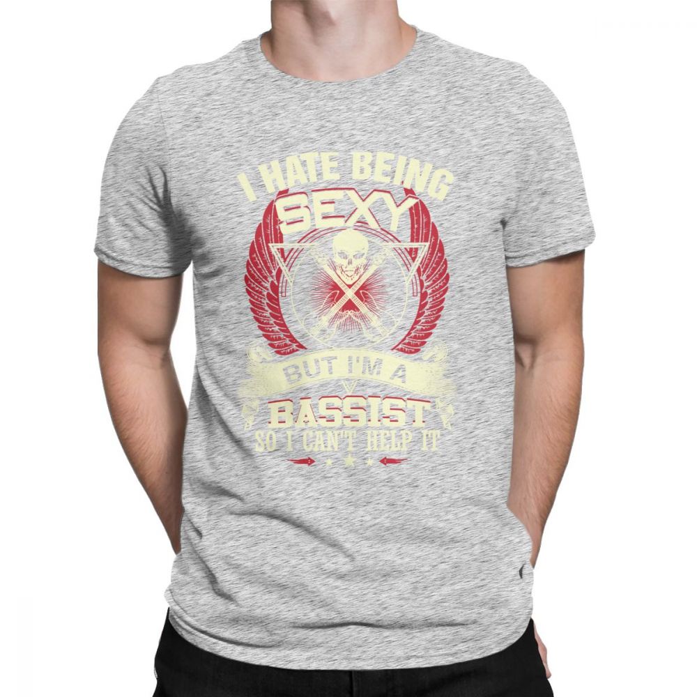 Gray t-shirt with 'I Hate Being Sexy But I'm A Bassist' print, featuring skull and wings, perfect for rock music lovers.