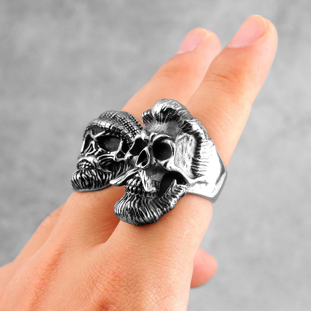 Bearded gentleman skull stainless steel ring worn on finger, showcasing gothic biker jewelry style.