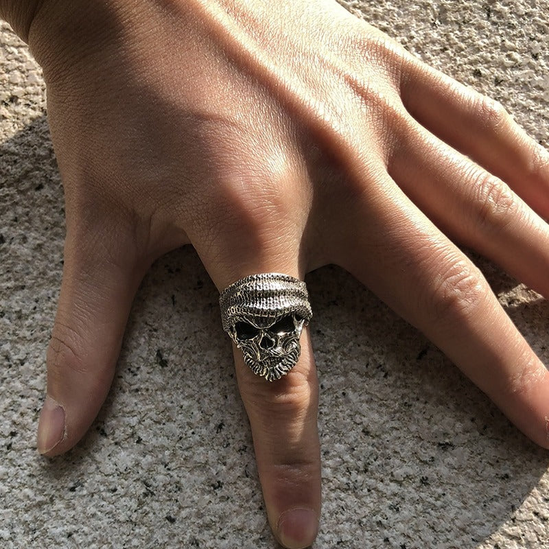 Men's 925 sterling silver bearded skull ring showcased on a hand, perfect for punk rock and gothic styles.