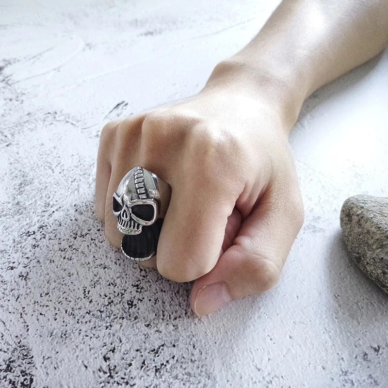 Gothic skull ring beer bottle opener worn on hand, showcasing punk fashion jewelry in silver metal.