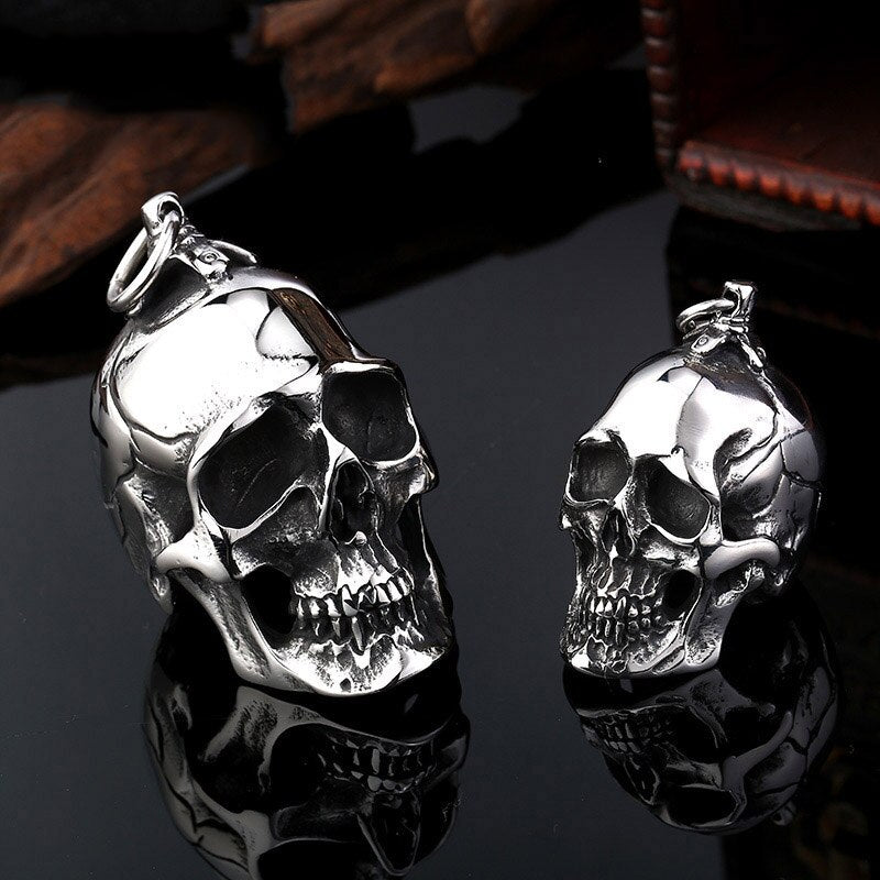 Big and small stainless steel skull pendants, perfect for creepy accessory fans, styled for men and women.