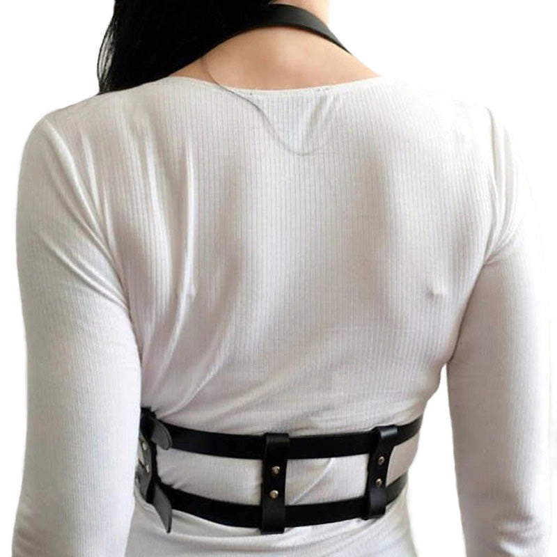 Back view of a woman in a white top wearing a black adjustable big body harness belt.