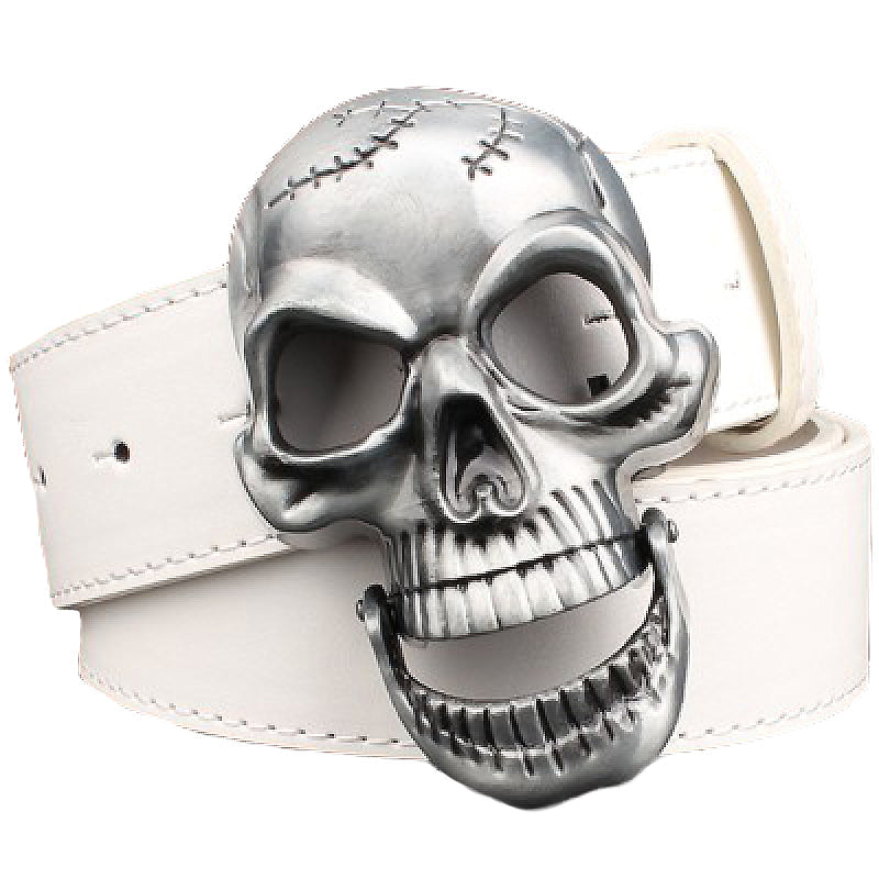 Rock-style leather belt featuring a large metal skull buckle on a white cowhide strap.