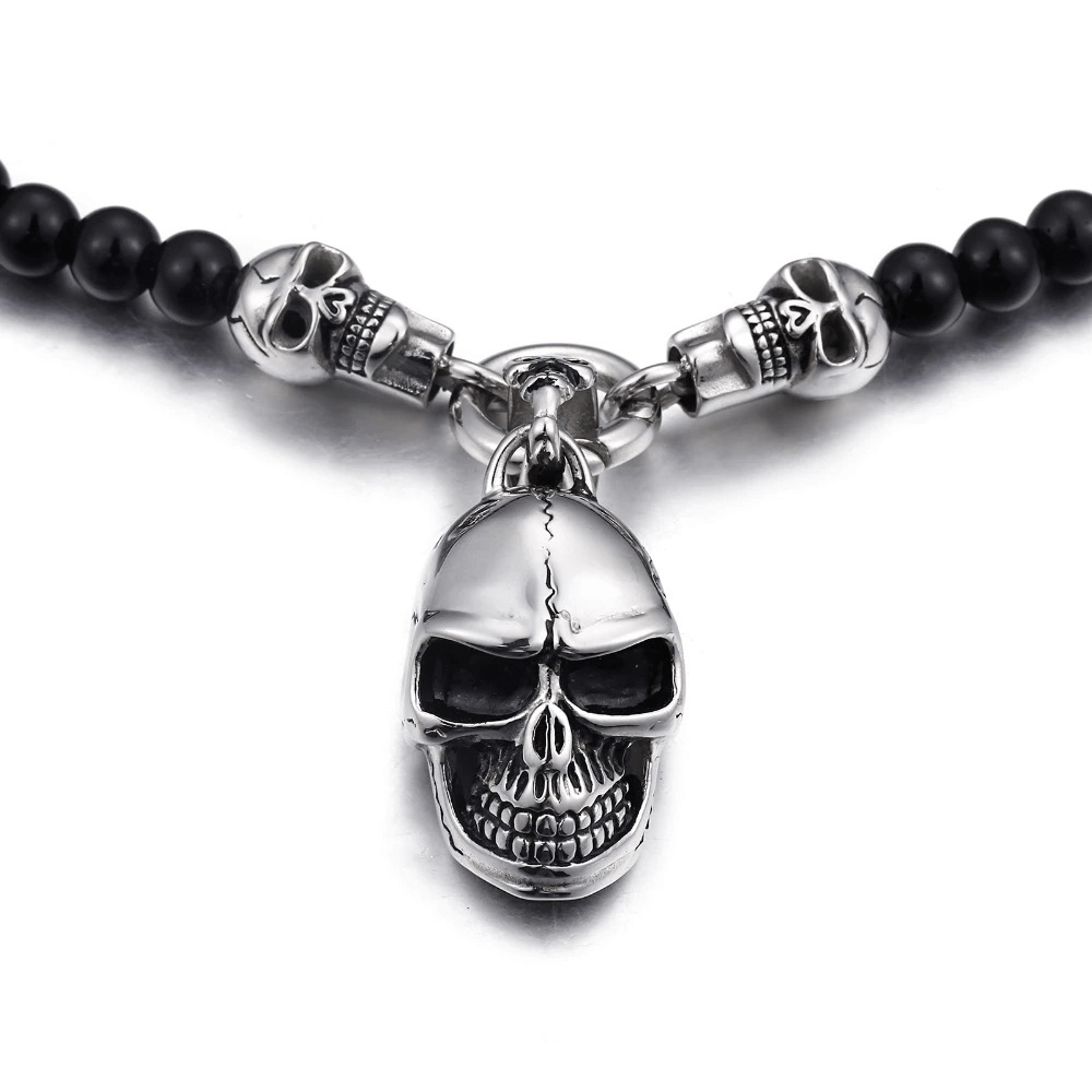 Stylish biker chain necklace featuring a stainless steel skull pendant and black glass beads, perfect for rock parties.