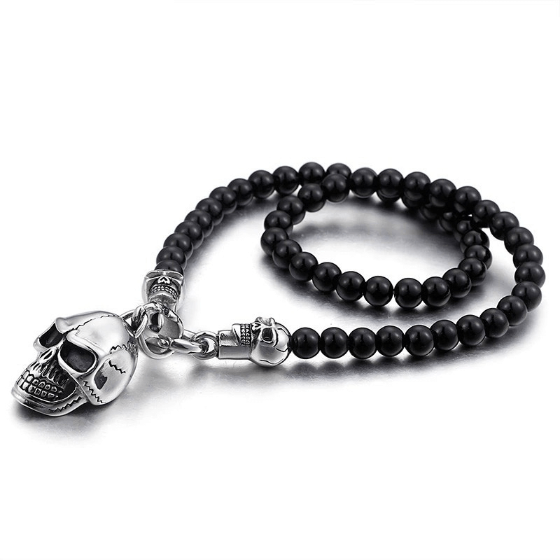 Biker chain necklace with black glass beads and stainless steel skull pendant for rock style enthusiasts.