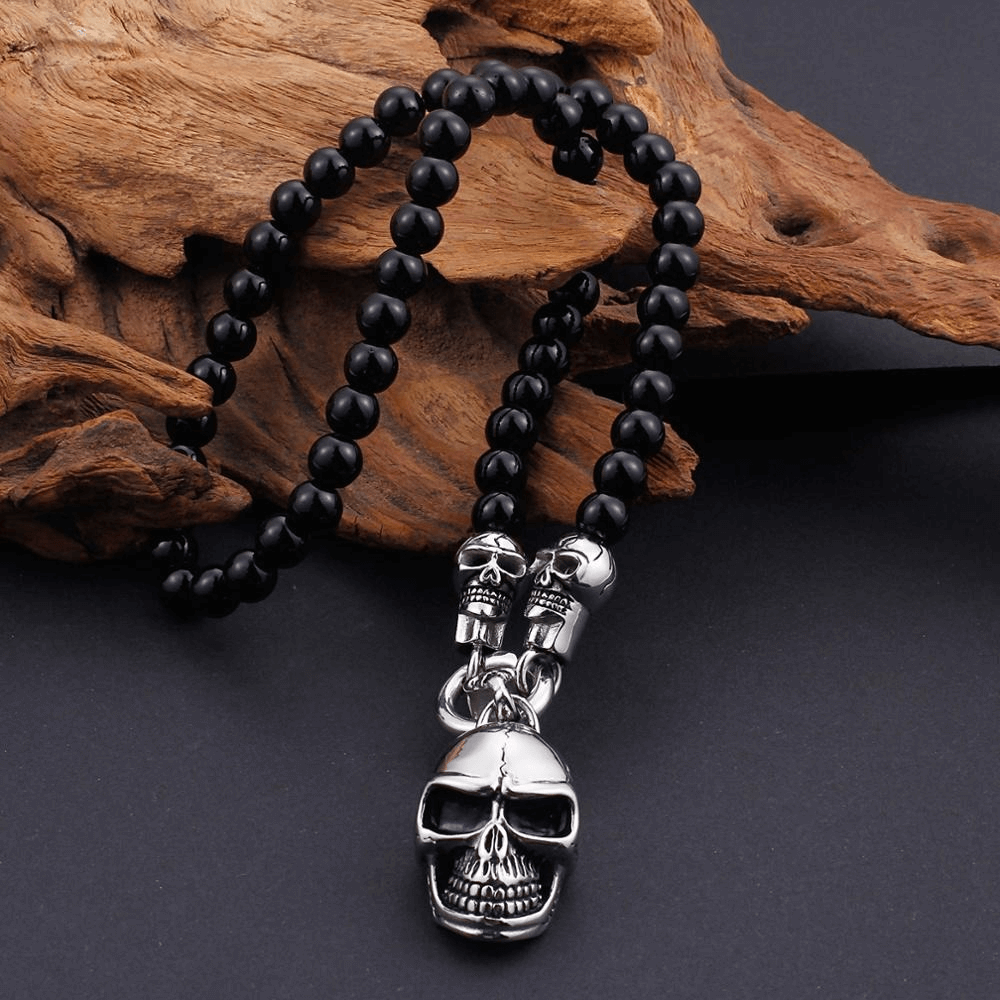 Biker chain necklace with glass beads and stainless steel skull pendant, perfect for rock concerts and parties.