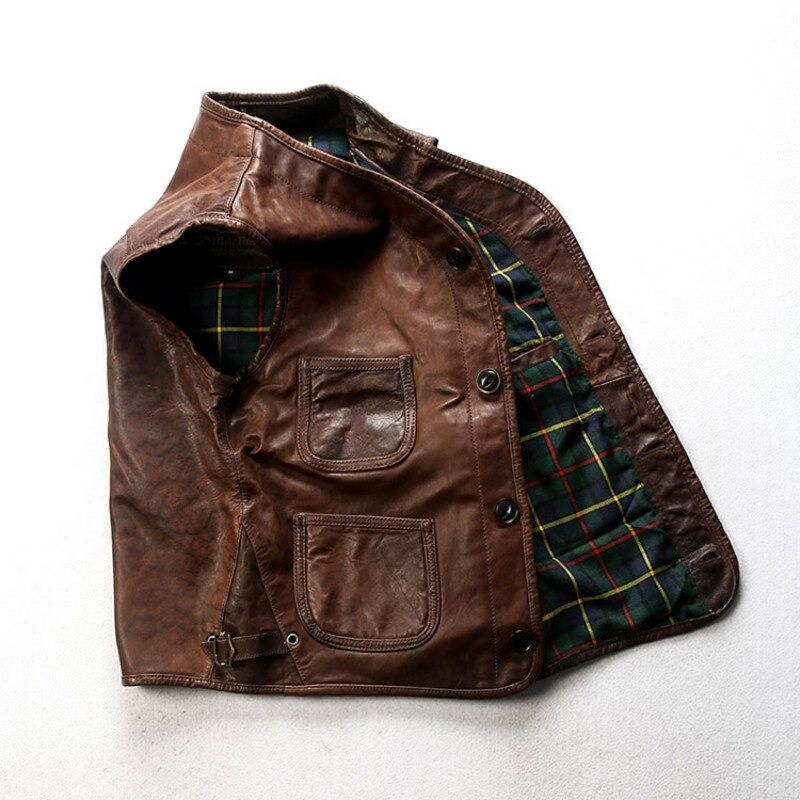 Genuine leather slim fit biker vest with pockets and plaid lining for a stylish, edgy look.