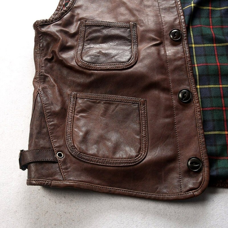 Biker genuine leather slim fit vest showing pockets and plaid lining, perfect for alternative fashion.