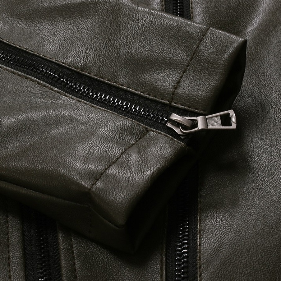 Close-up of oblique zipper on a stylish men's PU leather biker jacket in olive green.