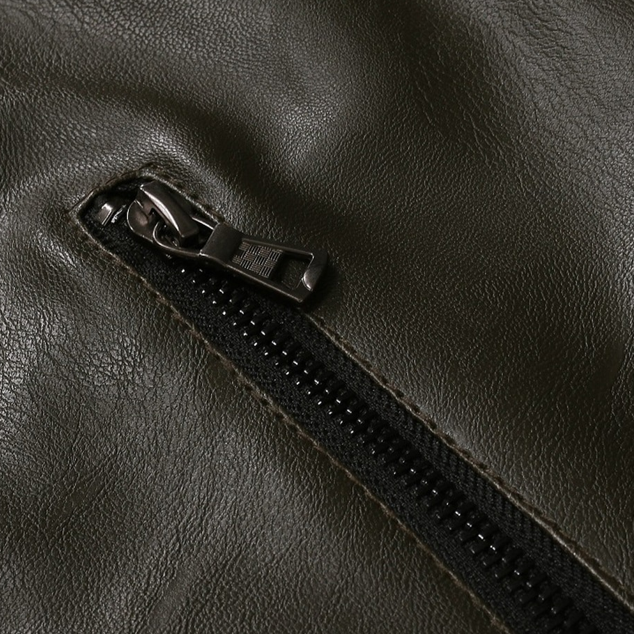 Close-up of a stylish oblique zipper on a men's PU leather biker jacket, showcasing high fashion details.