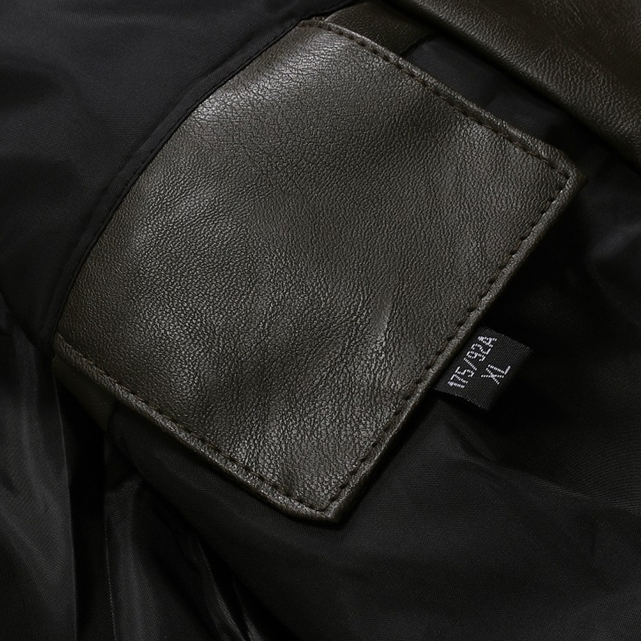 Close-up of interior label on men's PU leather biker jacket, showcasing quality craftsmanship and style.