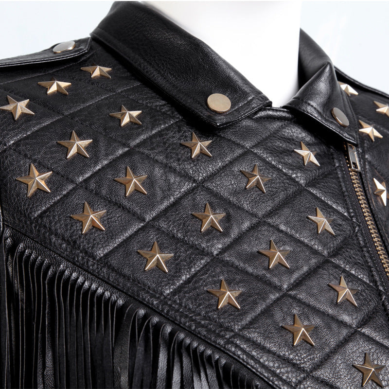 Close-up of a stylish black leather biker jacket with gold star studs and fringe detailing.