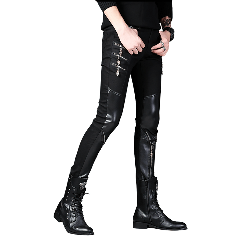 Stylish biker male in black patchwork skinny trousers, showcasing trendy fashion with edgy boots.