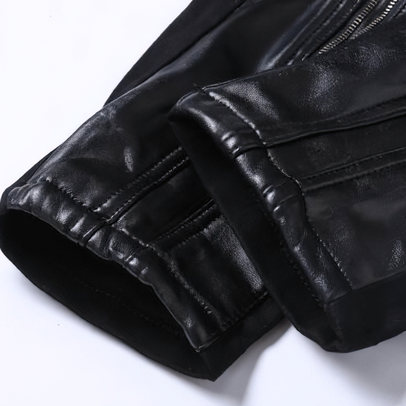 Close-up of the stylish hems on biker black patchwork skinny trousers for men.