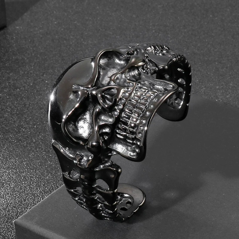 Black stainless steel skull bracelet for men, perfect for gothic fashion and stylish outfits.
