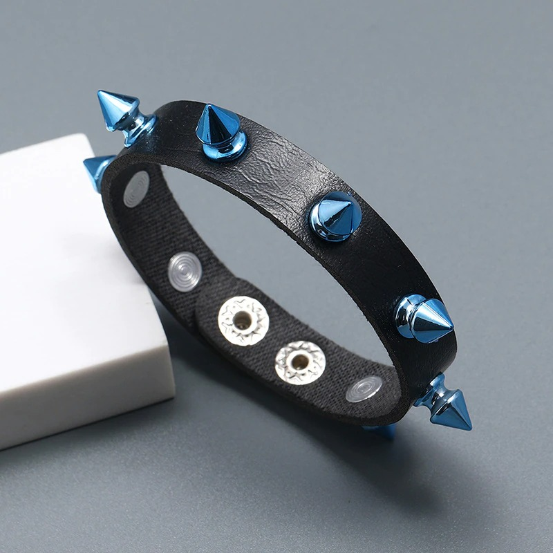 Biker unisex bracelet in PU leather featuring blue spikes, ideal for trendy punk style outfits.