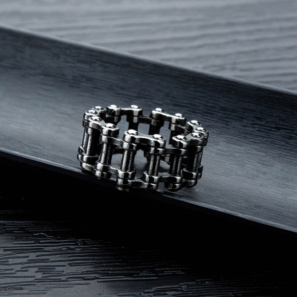 Stainless steel biker chain ring on a black surface, perfect for punk rock style for men and women.